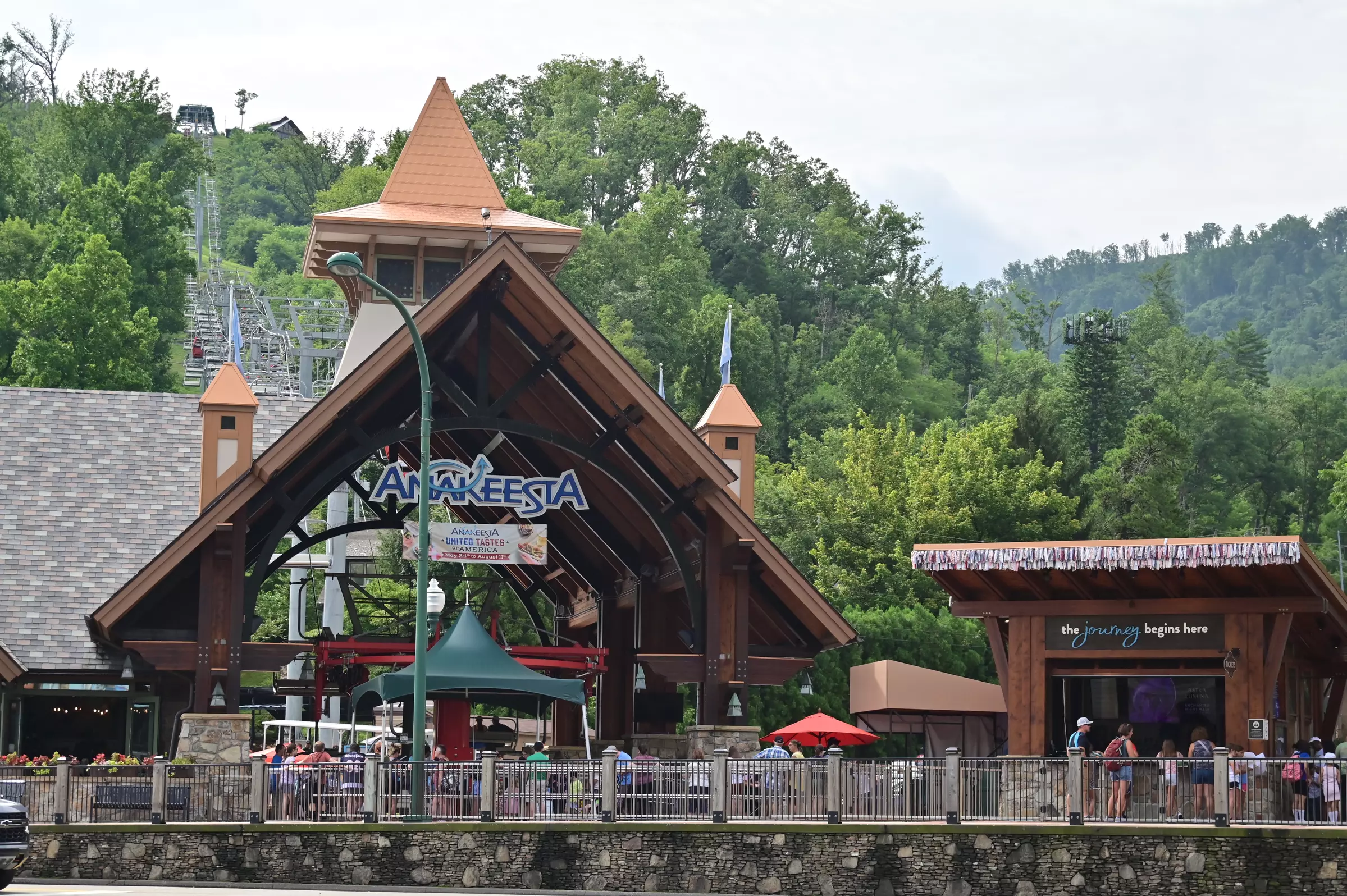 The bustling main street of downtown Gatlinburg lined with shops and attractions